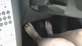 bare-feet-driving-pedal-pump