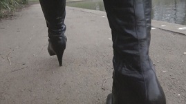 girl-in-leather-boots-high-heels-walking