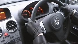 girl-wearing-leather-driving-gloves-in-manual-car